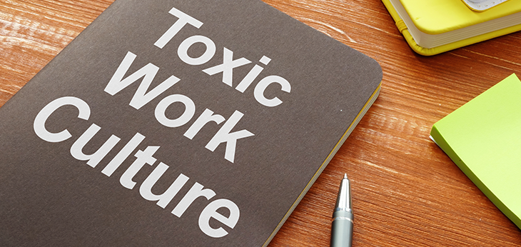 Book on a desk titled Toxic Work Culture